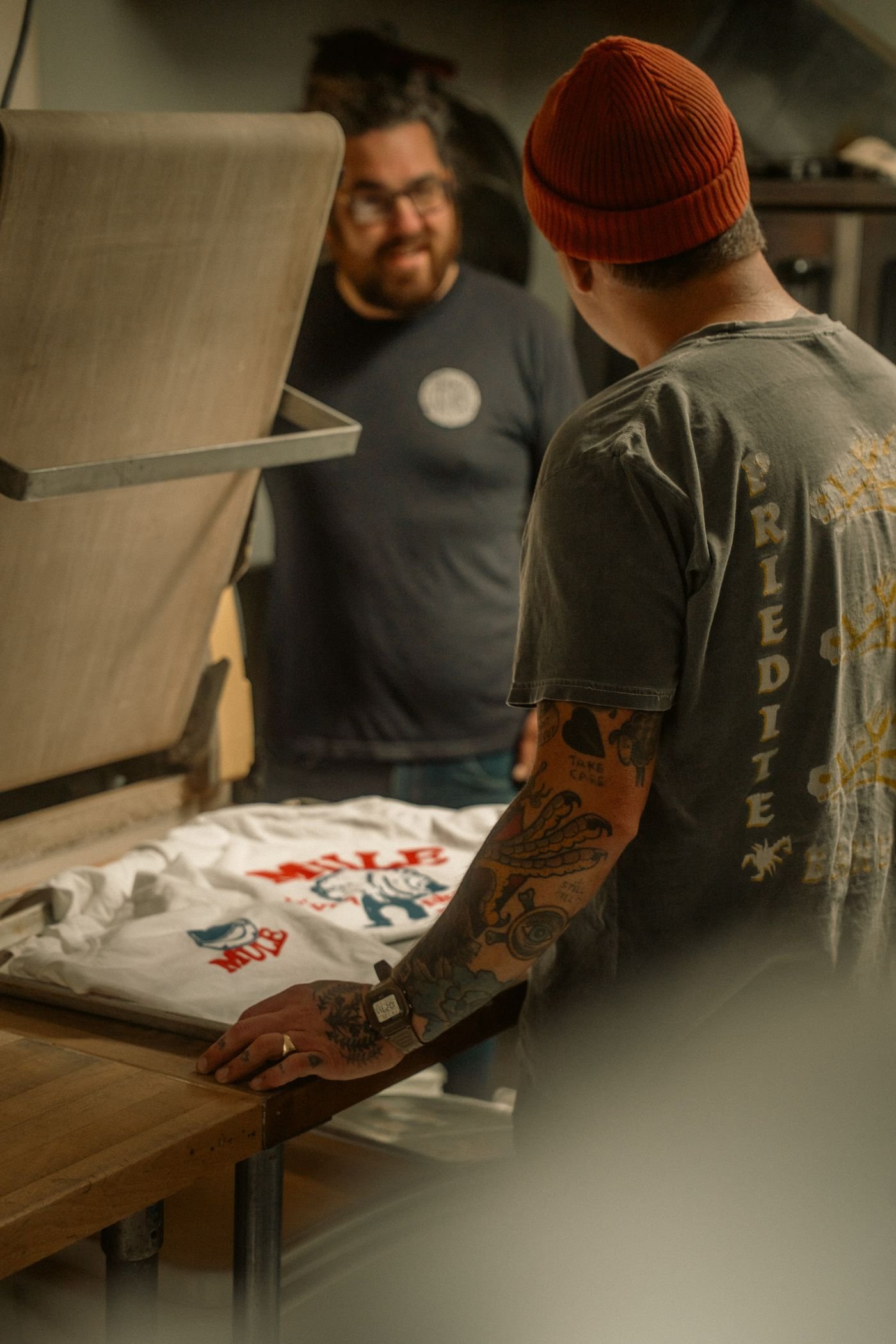 Printers working on custom apparel